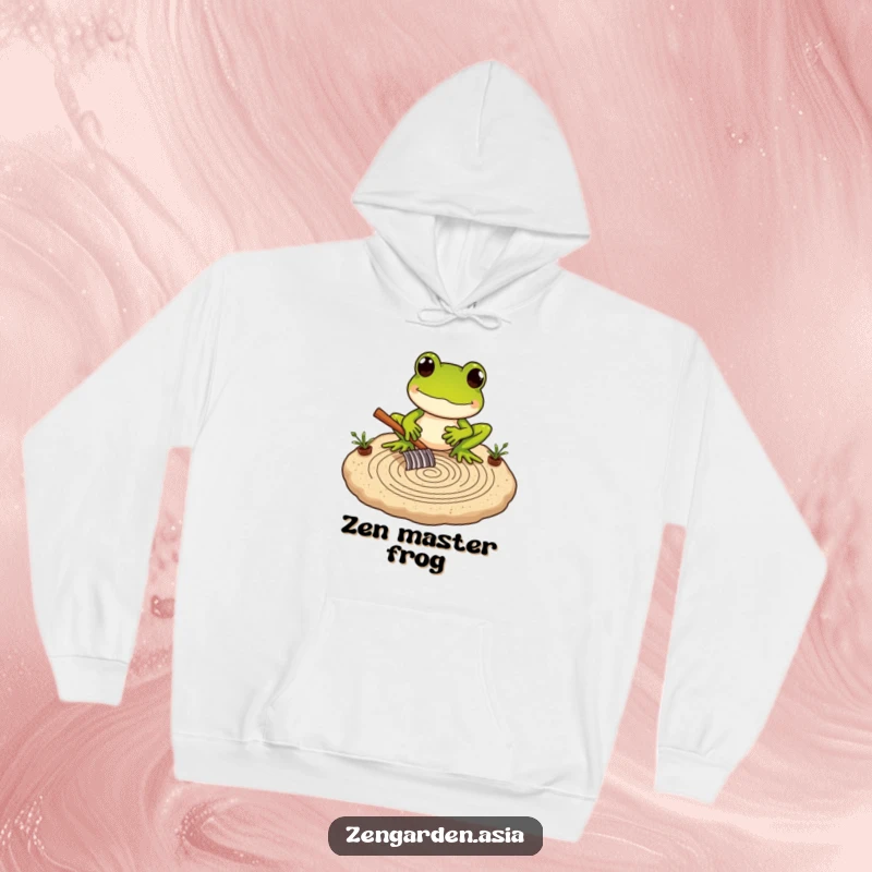Funny Frog Zen Master Hoodie featuring a frog carefully raking intricate patterns in a miniature sand garden, for cozy contemplation.