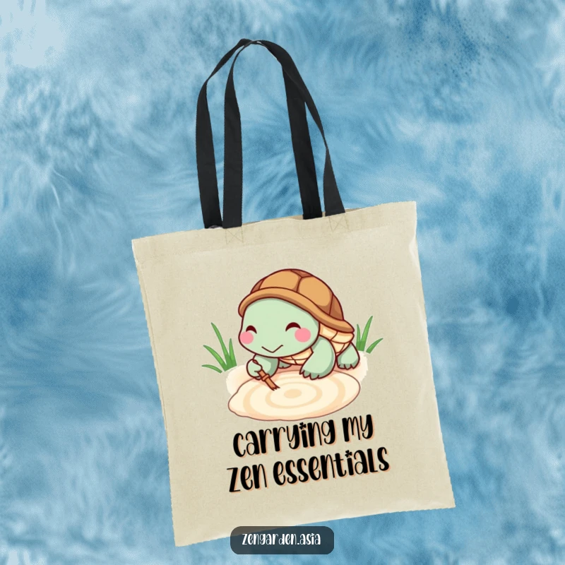 Funny Turtle Zen Tote Bag: A tiny, grinning turtle rakes a serene pattern in a sandbox, symbolizing calm creativity on the go.