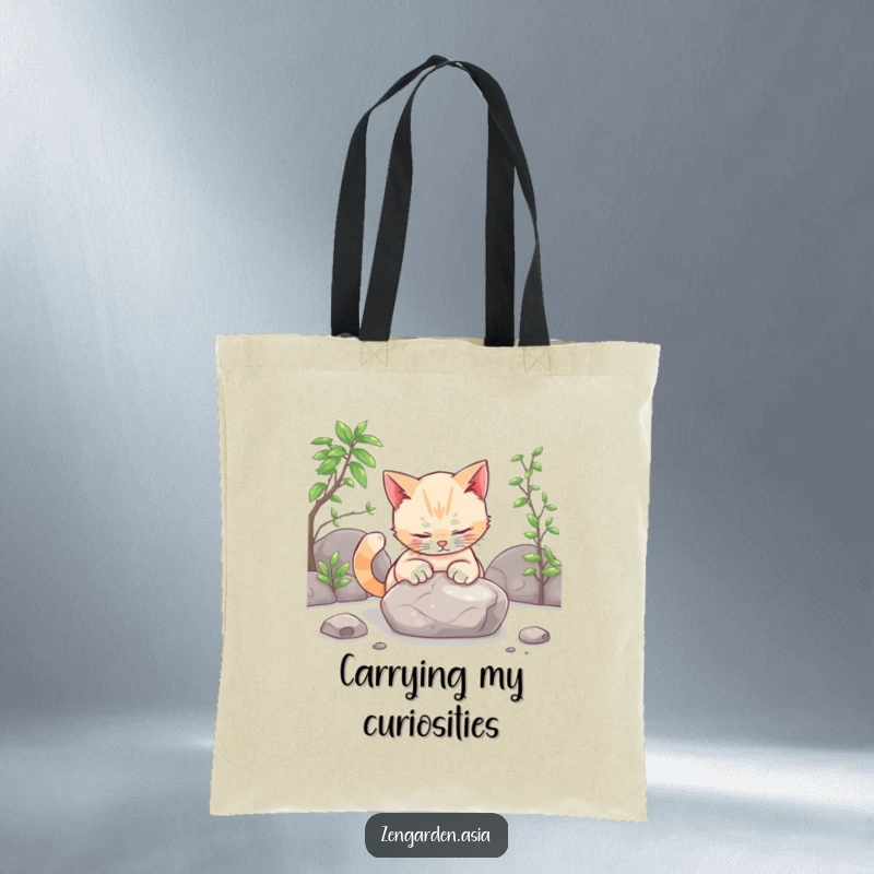 Funny cat zen tote bag, a curious cat gently patting a smooth stone in a zen garden, stylish and functional.